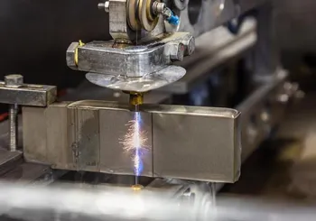 Welding technician working on metal components